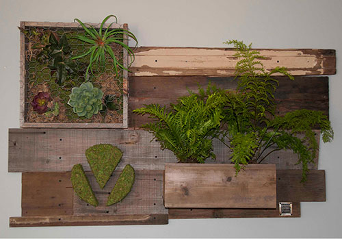 Vertical wall garden design by Urban Garden Studio | Moss wrapped logo with reclaimed wood Vertical wall garden, Living wall, reclaimed wood, moss, succulents, ferns, planters, custom logos, moss logo, green living room walls, living garden wall art