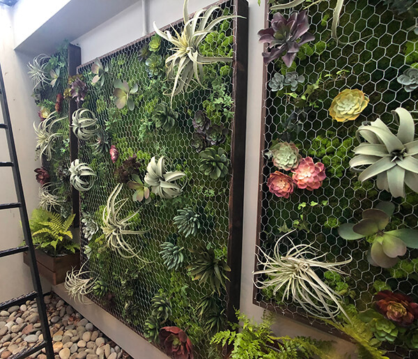 Beautiful vertical wall garden made from barnwood, succulents and moss by Urban Garden Studio Vertical wall garden, Living wall, reclaimed wood, moss, succulents, ferns, air plants, planters, custom logos, office design, interior design, logo in moss, monogramed letter, ferns, Living room design,moss logo